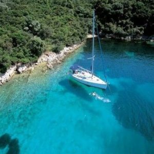 Italy islands private charter in charming blue bay, enjoying the Dolce Vita.